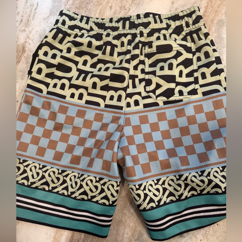 Boys Burberry Black and Green BB Patterned Mesh Shorts.